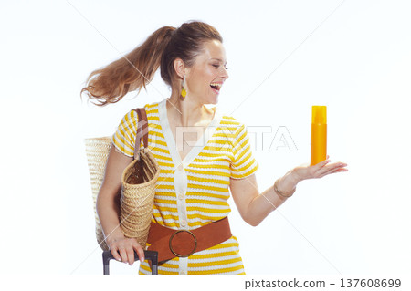 Joyful Woman Laughing with Sunscreen and Vacation Bag Joyful Woman Laughing with Sunscreen and Vacation Bag 137608699