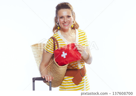 Woman Checking First Aid Kit for Safe Holiday Travel Woman Checking First Aid Kit for Safe Holiday Travel 137608700