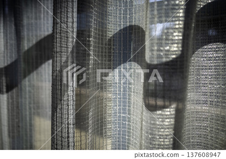 Lace curtains through the window Lace curtains through the window 137608947