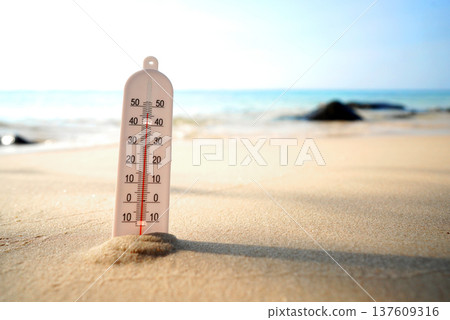 Thermometer on sunset sea beach in tropical. Extremely hot day.  137609316