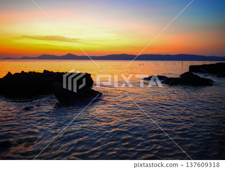 Tranquil sunset on Phu Quoc Island, Vietnam. Tranquil landscape overlooking waterway Tranquil sunset on Phu Quoc Island, Vietnam. Tranquil landscape overlooking waterway 137609318