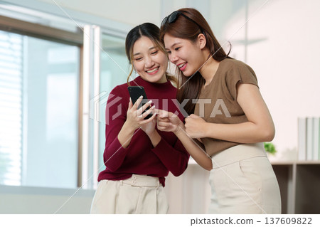 Social Media. Two friends sharing beauty tips while filming a skincare tutorial. 137609822