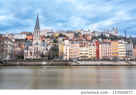 Lyon, france. December 29, 2023. Lyon cityscape with colorful hillside buildings, saint george church and basilica of notre dame de fourviere overlooking the saone river Lyon, france. December 29, 2023. Lyon cityscape with colorful hillside buildings, saint george church and basilica of notre dame de fourviere overlooking the saone river 137609877