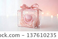 Its a Girl Baby Shower Gift in Clear Acrylic Box with Pink Pacifier on Soft Bokeh Background 137610235