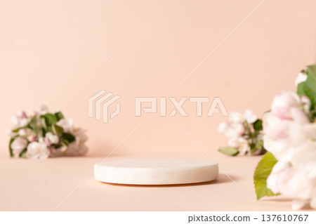 White empty podium and blurred cherry blossom flowers against pink background. White empty podium and blurred cherry blossom flowers against pink background. 137610767