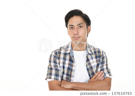 A man with his arms folded A man with his arms folded 137610783