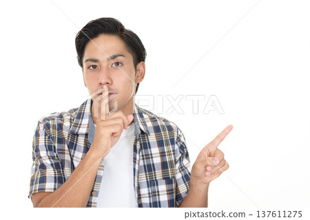 Man pointing at space 137611275