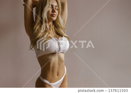 Sexy beauty and body care concept with busty woman in white lingerie, slim waist, toned body and healthy lifestyle 137611503