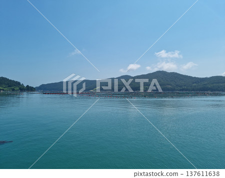 It is a landscape with an island and the sea. It is a landscape with an island and the sea. 137611638