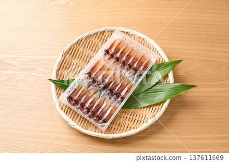 Raw firefly squid lined up in a case Raw firefly squid lined up in a case 137611669