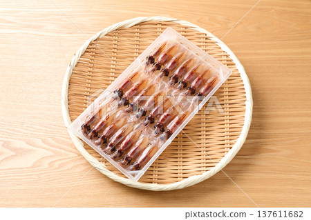 Raw firefly squid lined up in a case Raw firefly squid lined up in a case 137611682