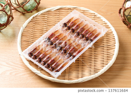 Raw firefly squid lined up in a case Raw firefly squid lined up in a case 137611684