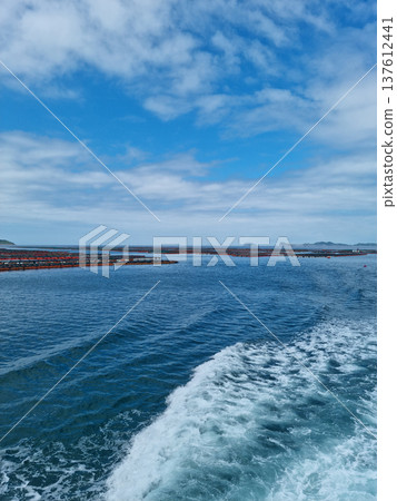 It is a blue sea and a ship trace. It is a blue sea and a ship trace. 137612441