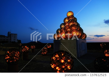 Bottle balls illuminated by the setting sun 137612523