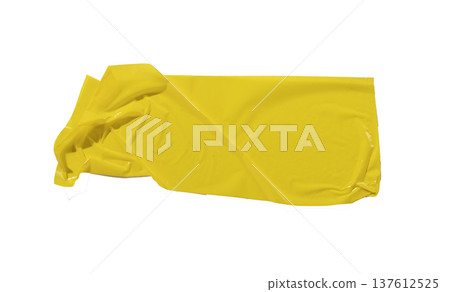 Asymmetric yellow adhesive tape piece isolated on white background. Glossy plastic surface with Asymmetric yellow adhesive tape piece isolated on white background. Glossy plastic surface with 137612525