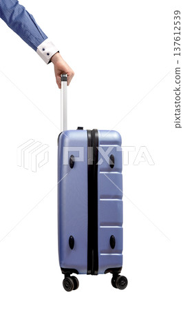 business hand holding suitcase. Side view of businessman pulling hardshell luggage with telescopic business hand holding suitcase. Side view of businessman pulling hardshell luggage with telescopic 137612539