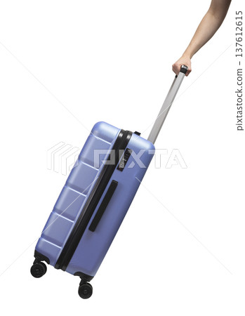 Hand pulling suitcase. Side view of large hardshell luggage with lock, zipper, and telescopic handle Hand pulling suitcase. Side view of large hardshell luggage with lock, zipper, and telescopic handle 137612615