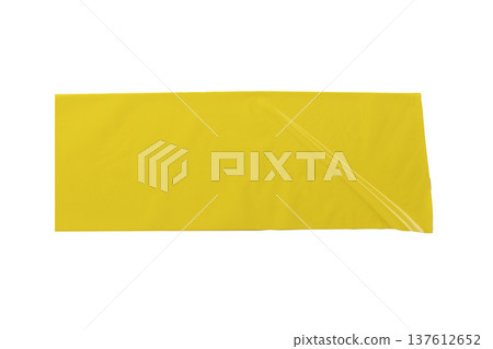 Wide yellow adhesive tape strip isolated on white background. Smooth glossy surface with slight fold Wide yellow adhesive tape strip isolated on white background. Smooth glossy surface with slight fold 137612652