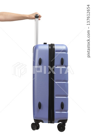 Woman pulling suitcase. Blue and purple wheeled hardcase luggage with telescopic handle and secure 137612654