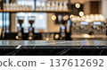 Empty dark marble stone table top surface in front of blurred modern cafe interior background with beautiful bokeh lights for product display presentation 137612692