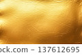 Luxurious shiny gold leaf foil texture showing detailed scratched metallic surface pattern for premium elegant background design and artistic holiday graphic decoration 137612695