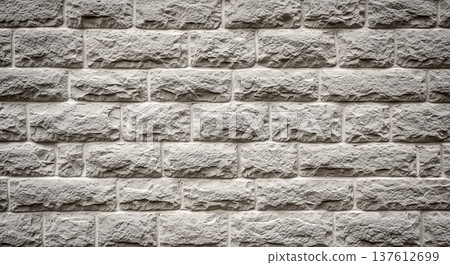 Detailed texture of grey decorative stone wall showing rough rectangular brick blocks pattern for interior exterior architecture facade design structural construction background Detailed texture of grey decorative stone wall showing rough rectangular brick blocks pattern for interior exterior architecture facade design structural construction background 137612699