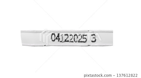identification label strip with printed black serial code isolated on white background. Narrow identification label strip with printed black serial code isolated on white background. Narrow 137612822