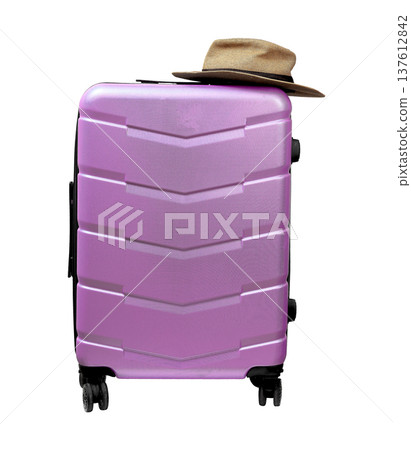 Wheeled polycarbonate suitcase with sunhat on top. Front view close up of modern hardcase luggage Wheeled polycarbonate suitcase with sunhat on top. Front view close up of modern hardcase luggage 137612842