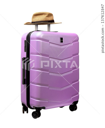 Wheeled hardshell suitcase with sunhat on top. Tilted angle, telescopic handle grip. Polycarbonate 137612847