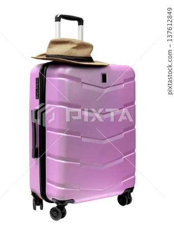 Heavy wheeled carry on suitcase for airport terminal. Pink bag and brimmed sunhat on top for summer 137612849