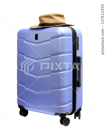 large wheeled carry on suitcase in blue and purple tones. Sunhat placed on top, summer beach and large wheeled carry on suitcase in blue and purple tones. Sunhat placed on top, summer beach and 137612850