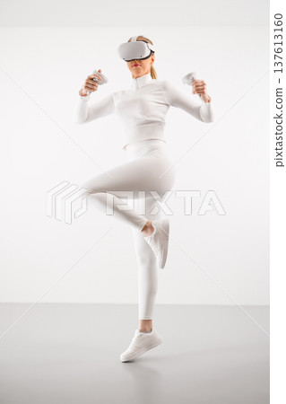 Athlete in VR glasses practicing martial arts Athlete in VR glasses practicing martial arts 137613160