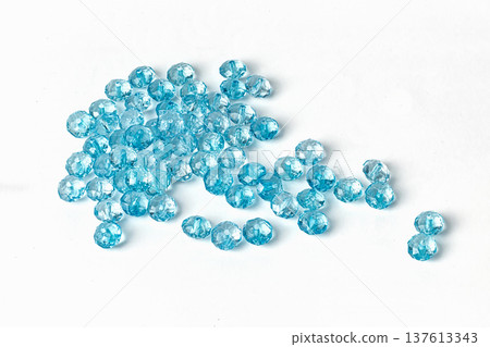 blue acrylic beads on a white background blue acrylic beads on a white background 137613343