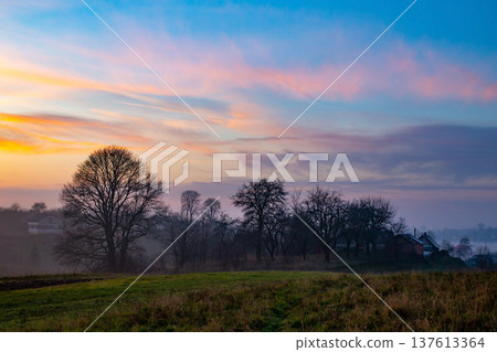 sunset in the field. beautiful autumn foggy landscape in Ukraine sunset in the field. beautiful autumn foggy landscape in Ukraine 137613364