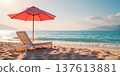 Lounge chair under red umbrella on serene beach. 137613881
