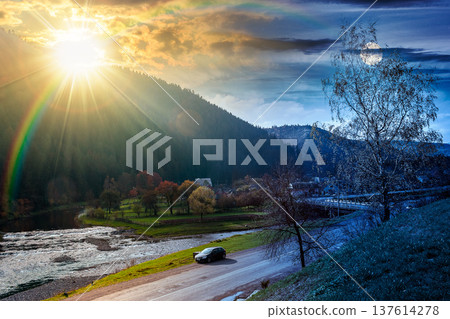 mountain landscape during fall season. day meet night. sun and moon over rural scenery with river at twilight. composite image of a countryside road through valley near village for travel background mountain landscape during fall season. day meet night. sun and moon over rural scenery with river at twilight. composite image of a countryside road through valley near village for travel background 137614278