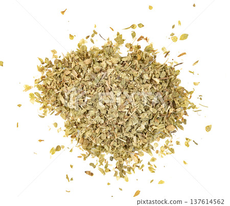 Top view of a pile of dried oregano leaves isolated. This Mediterranean herb is a common spice used in cooking Italian and Greek cuisine for flavoring pizza and pasta recipes. 137614562