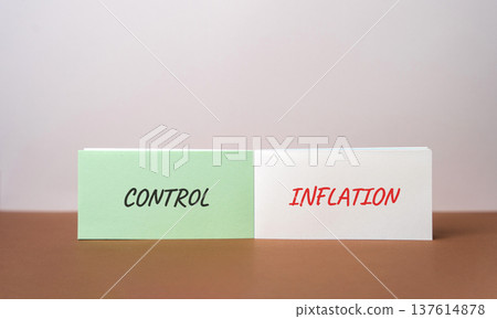 Control inflation concept. Balancing prices, costs, and purchasing power through financial policy, budgeting, and market regulation. Inscription on notebook Control inflation concept. Balancing prices, costs, and purchasing power through financial policy, budgeting, and market regulation. Inscription on notebook 137614878