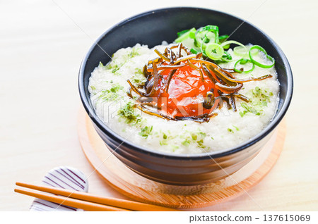 Egg yolk pickled in salted kelp served on grated yam rice Egg yolk pickled in salted kelp served on grated yam rice 137615069