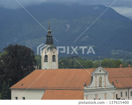 Scenic panoramic view of the town of Kamnik with the old castle on the hill in Slovenia 137615400