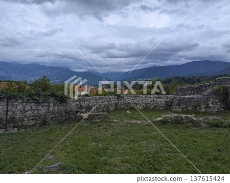 Scenic panoramic view of the town of Kamnik with the old castle on the hill in Slovenia Scenic panoramic view of the town of Kamnik with the old castle on the hill in Slovenia 137615424