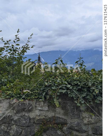 Scenic panoramic view of the town of Kamnik with the old castle on the hill in Slovenia Scenic panoramic view of the town of Kamnik with the old castle on the hill in Slovenia 137615425