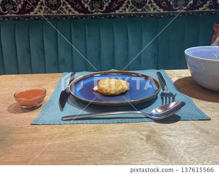 a potato pancake on the plate 137615566