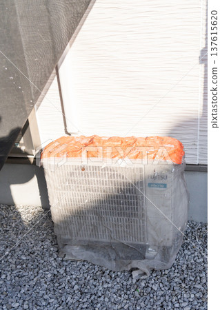 Air conditioner outdoor unit covered with exterior paint Air conditioner outdoor unit covered with exterior paint 137615620