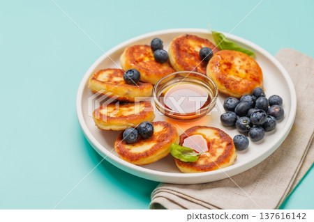 Homemade pancakes with blueberries and syrup 137616142