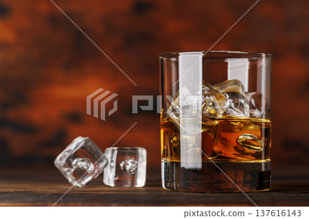 Glass of whiskey with ice Glass of whiskey with ice 137616143