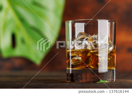 Glass of whiskey with ice 137616144