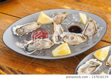 Fresh oysters on ice with champagne 137616174