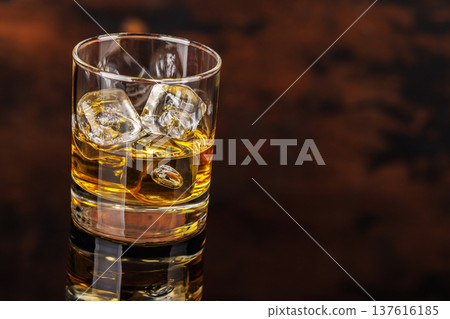 Glass of whiskey with ice 137616185