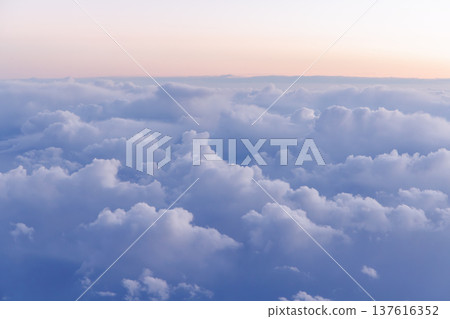 Sunset above the clouds from airplane 137616352